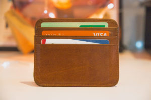 Brown wallet with credit cards inside.